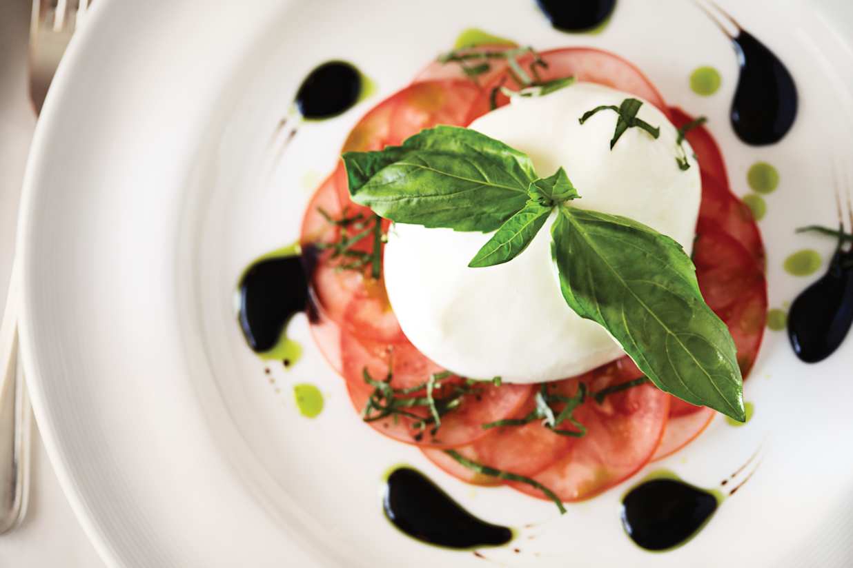 A caprese salad being served onboard Majestic Princess